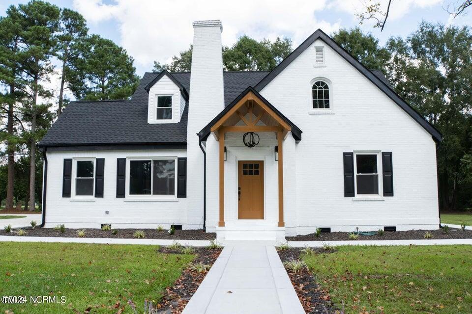 a front view of a house with a yard