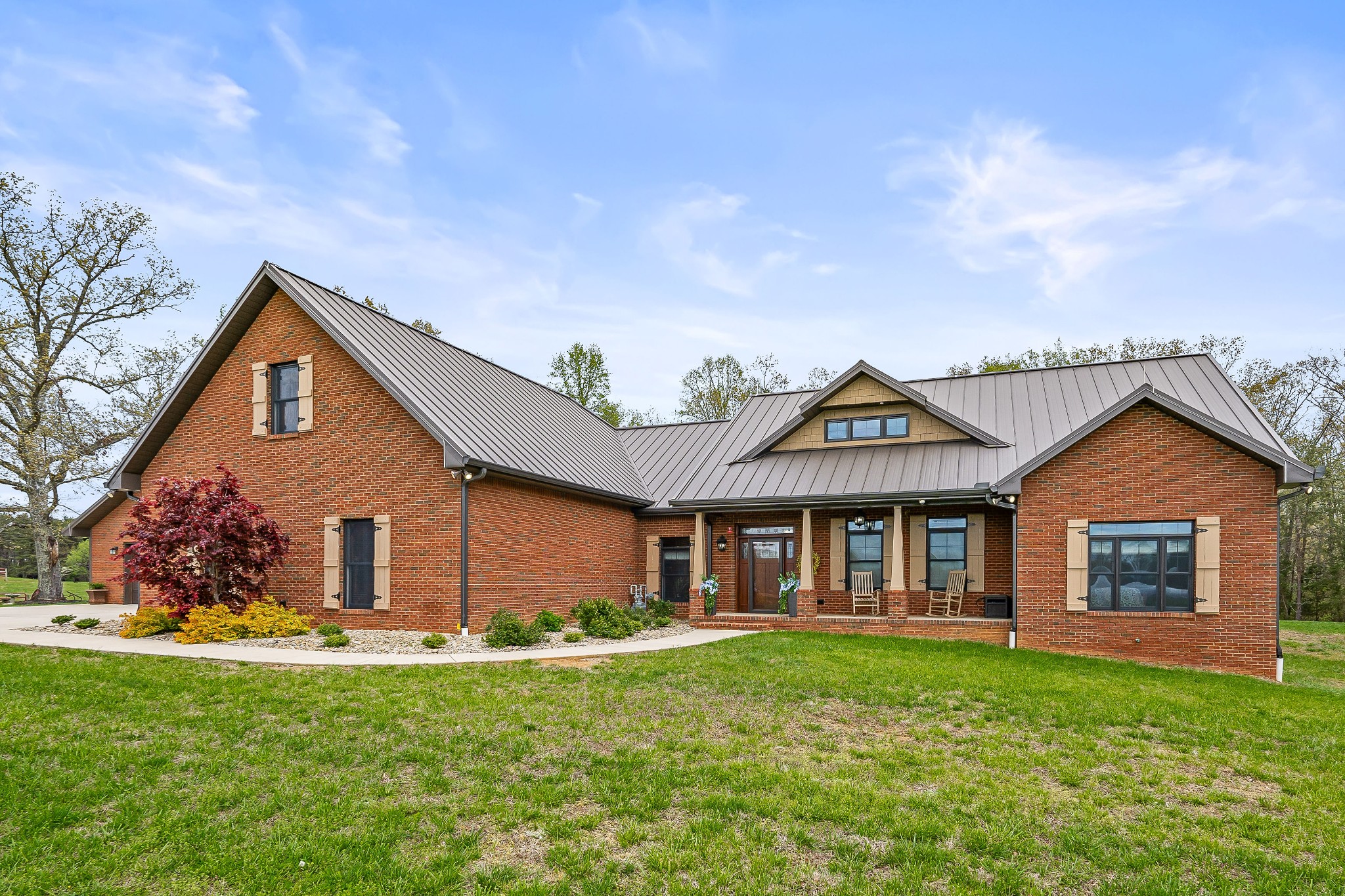 a front view of a house with a yard