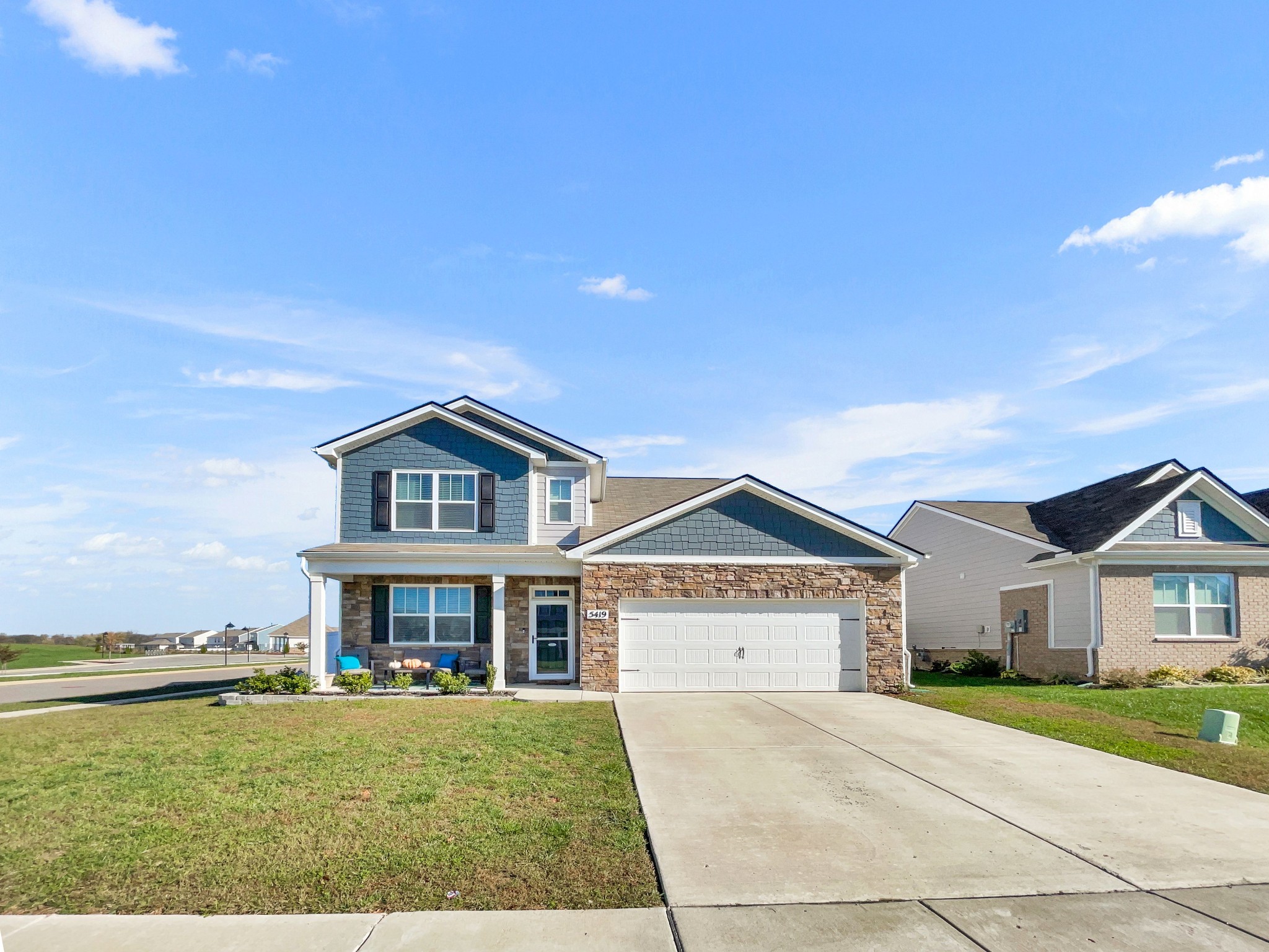 a front view of a house with a yard