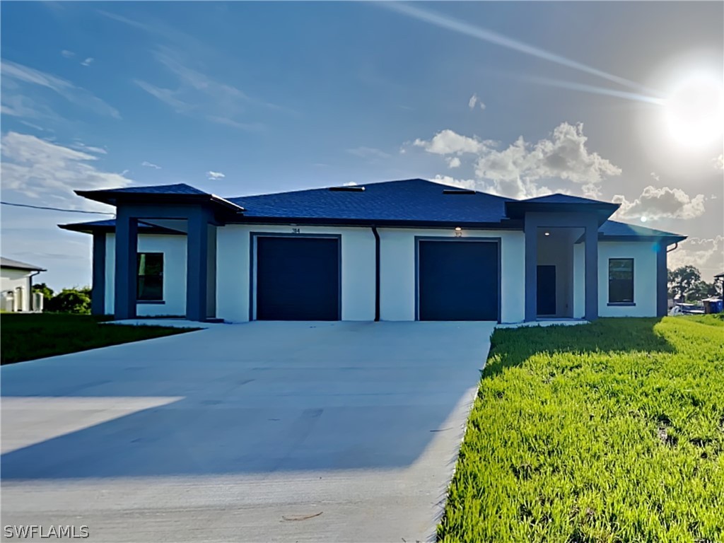 front view of a house with a yard