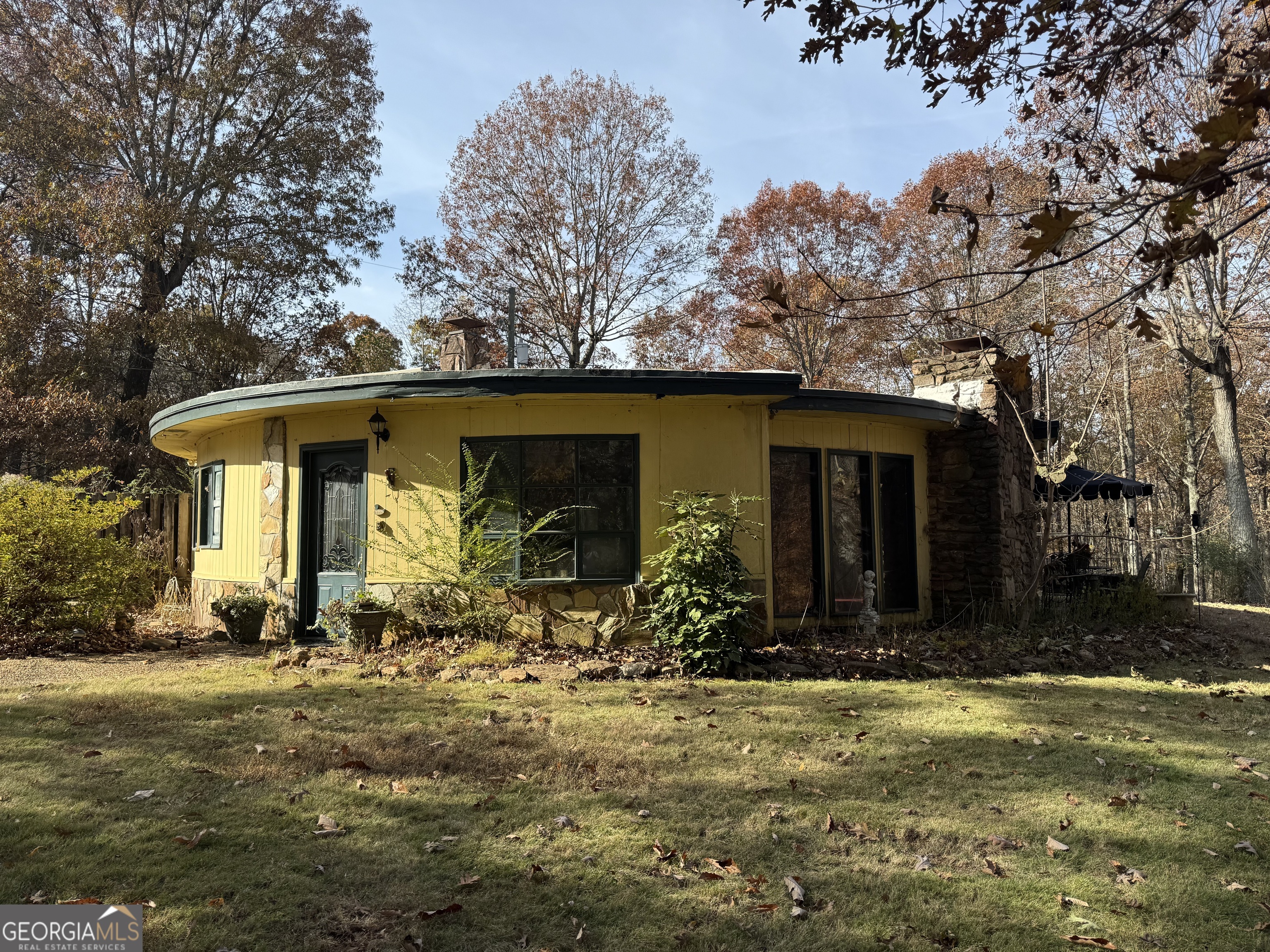 a front view of house with outdoor seating