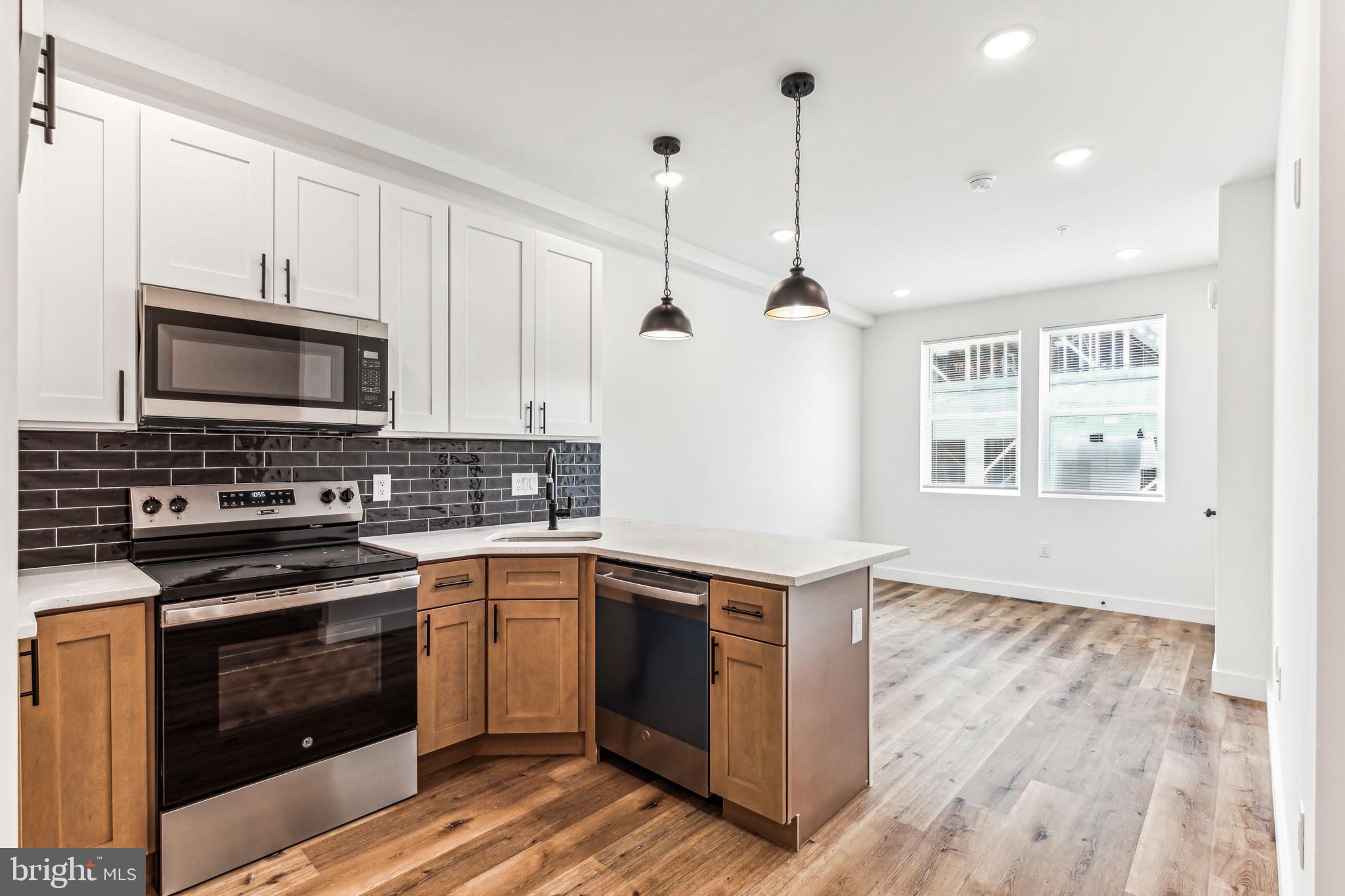 a kitchen with a stove and a sink