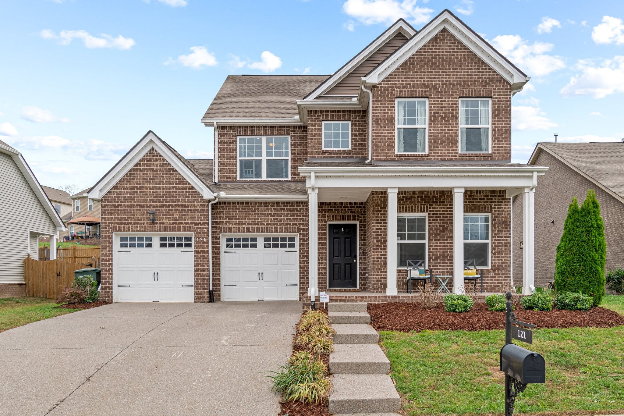 front view of a house with a yard