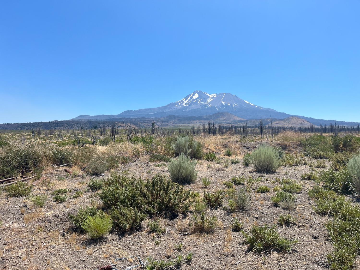 a view of a sky with mountains in the background