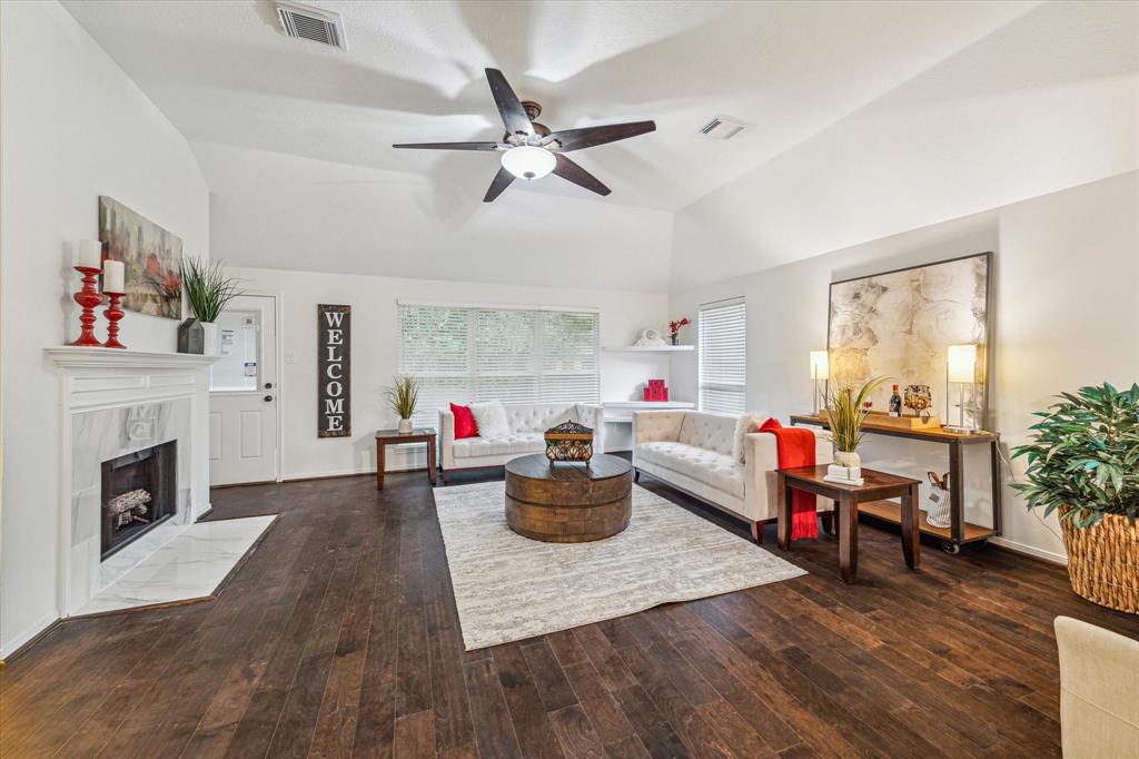 a living room with furniture and a fireplace