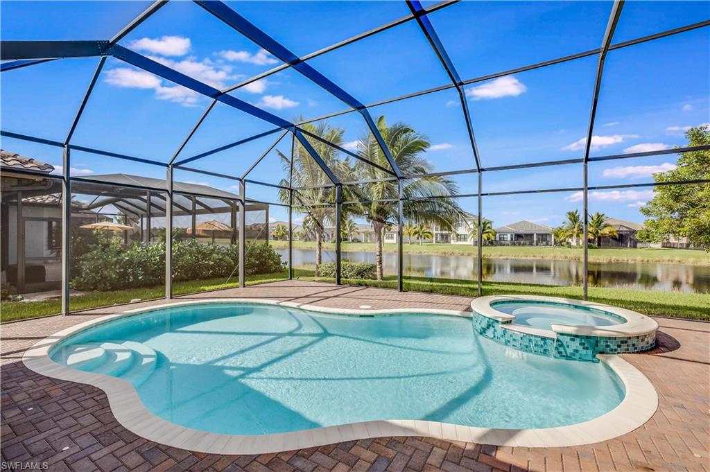 a view of a swimming pool with a yard