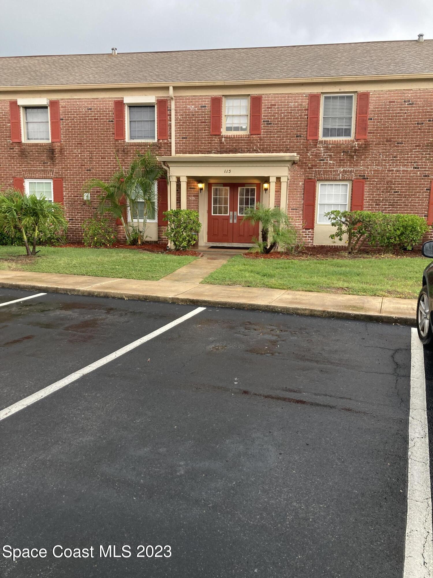 a front view of building with yard