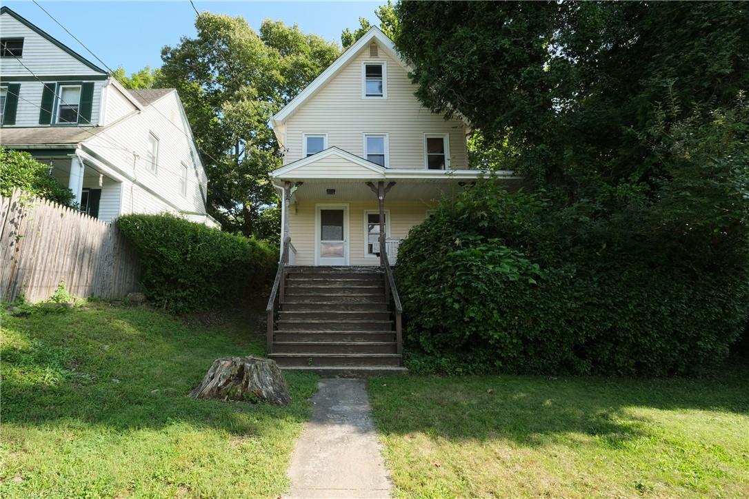 View of front of house with a wrap around  porch.