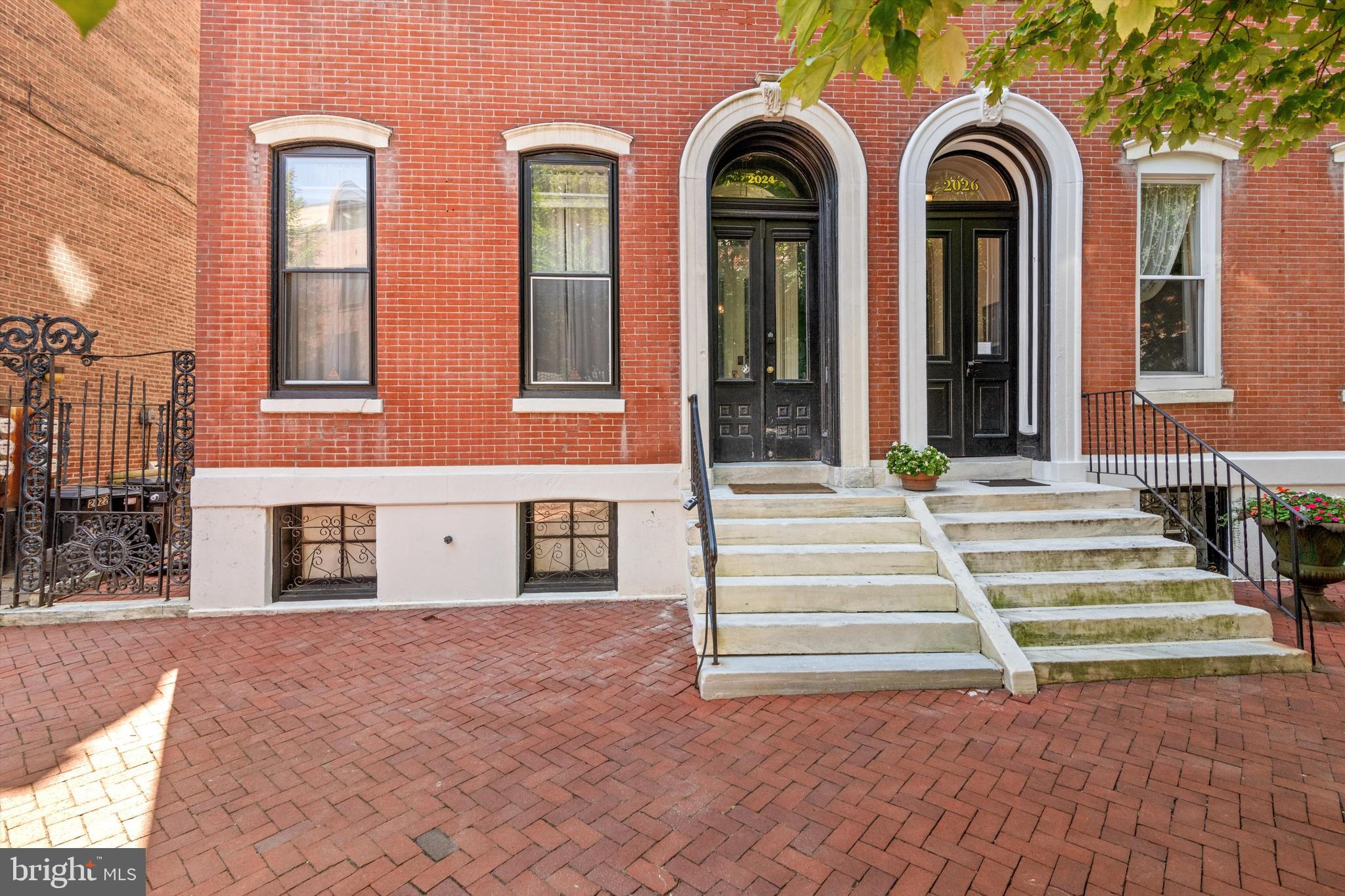 a view of a brick building with many windows