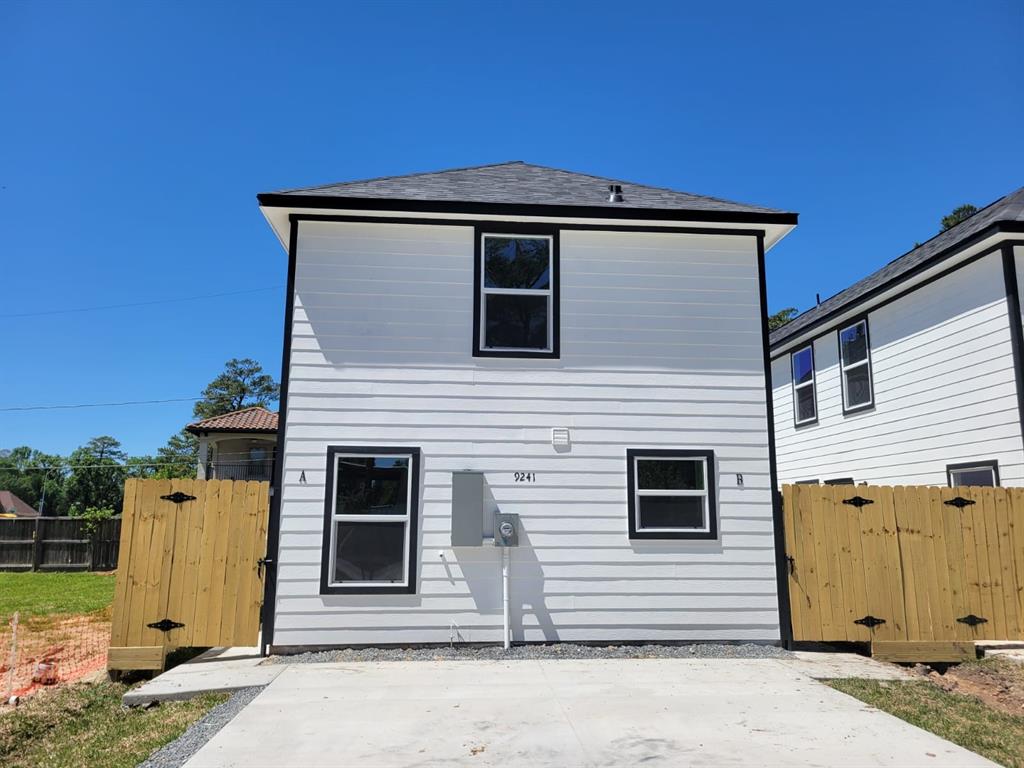 a front view of a house with garage