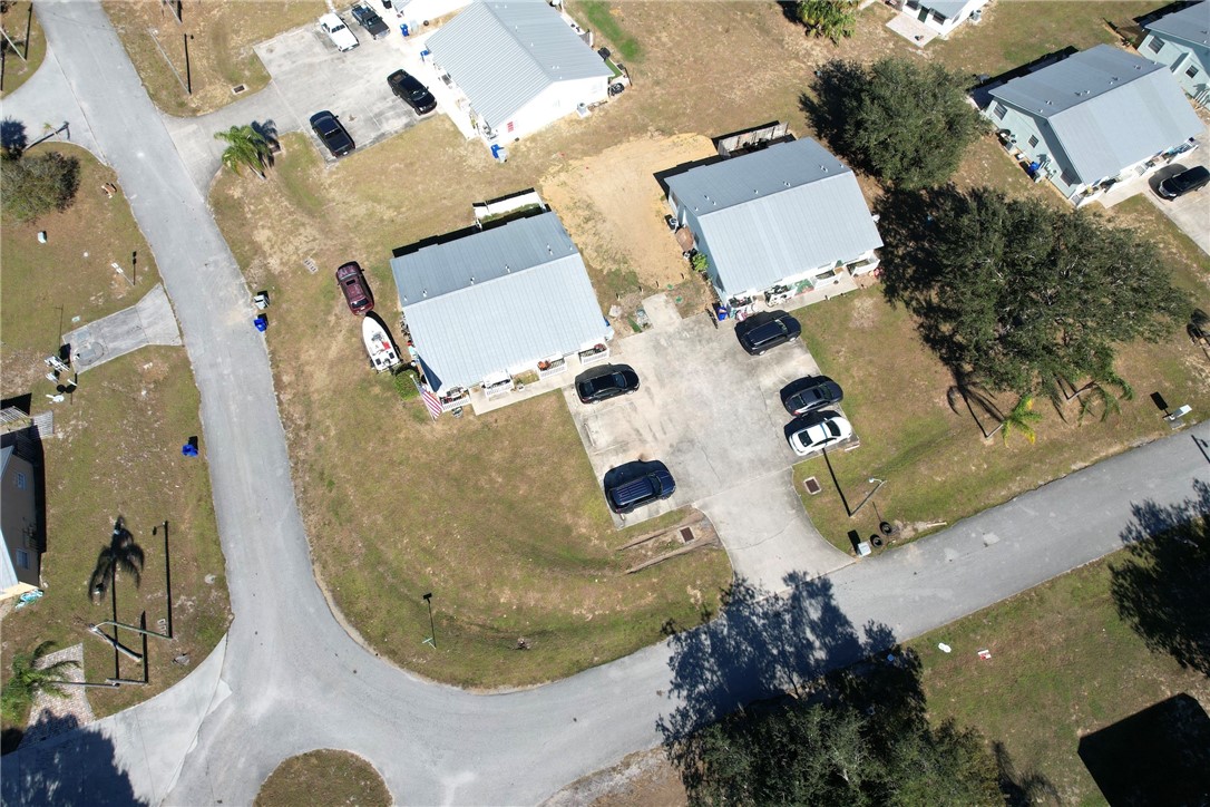 an aerial view of a house with a swimming pool