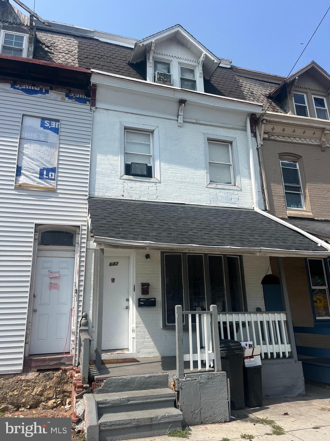 a front view of a house with a porch