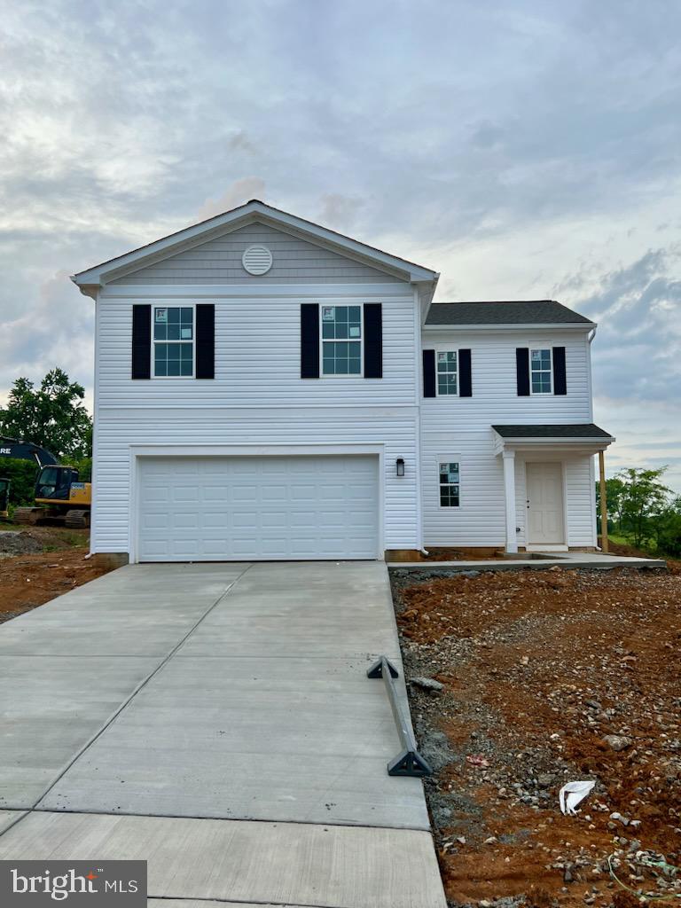 a front view of a house with garage