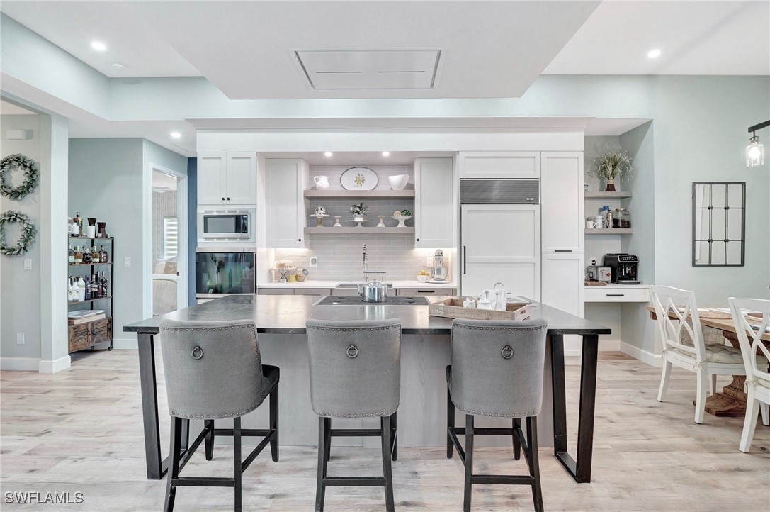 a kitchen with a table and chairs in it