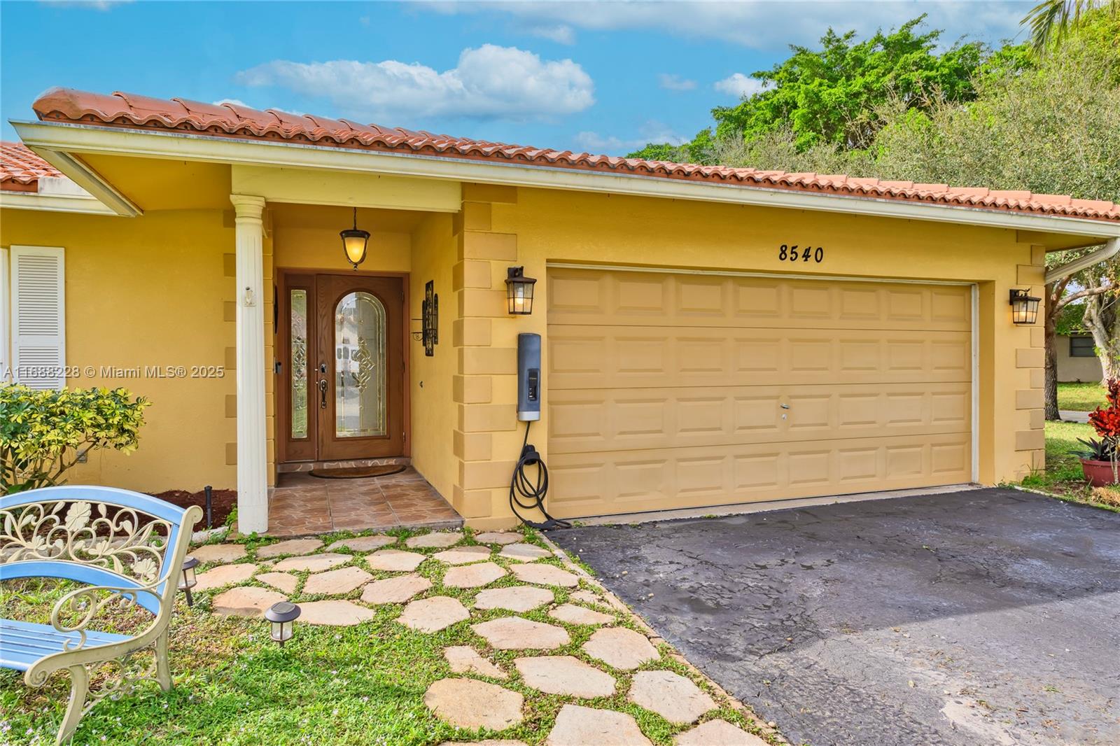 a front view of a house with a yard