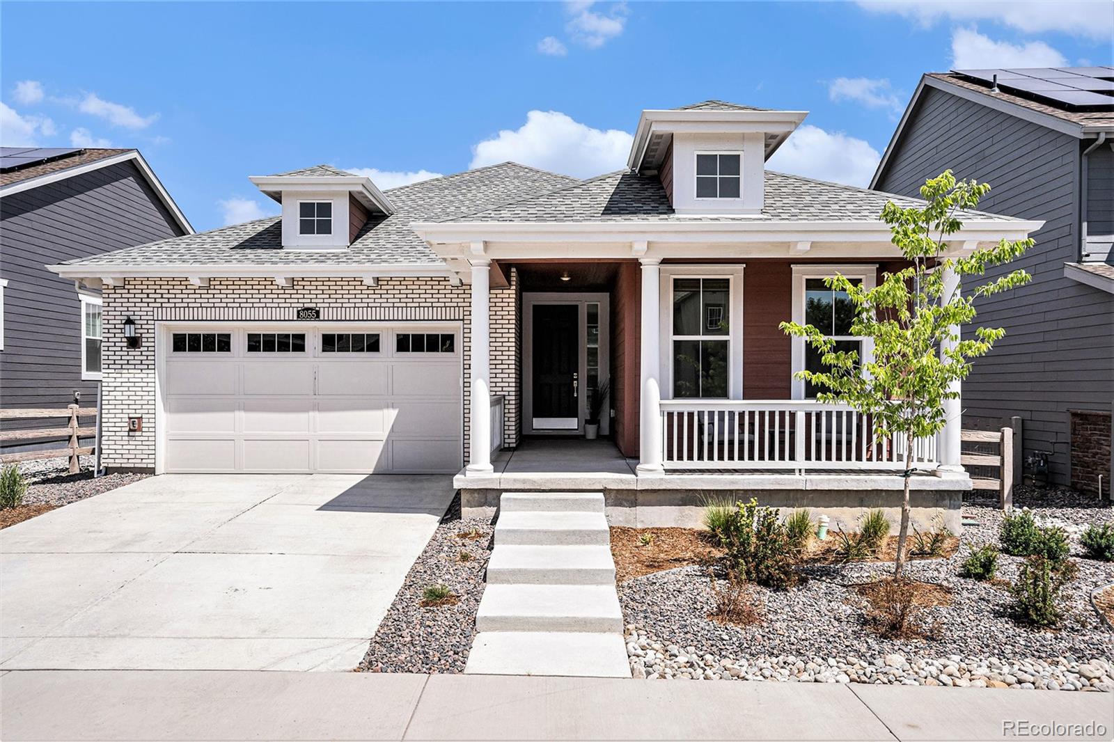 a front view of a house with a porch