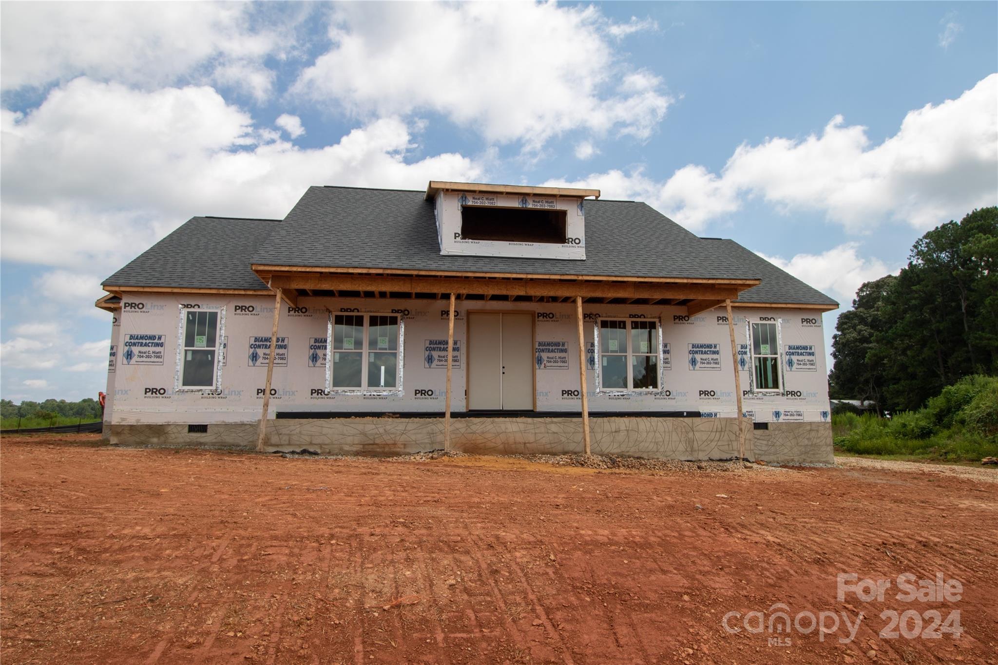 front view of a house with a yard