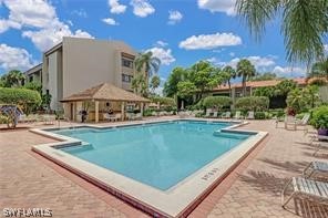 a view of a swimming pool with a patio