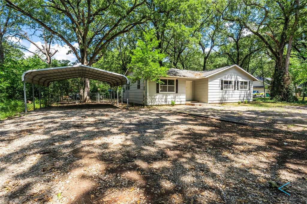 Ranch-style house with a carport