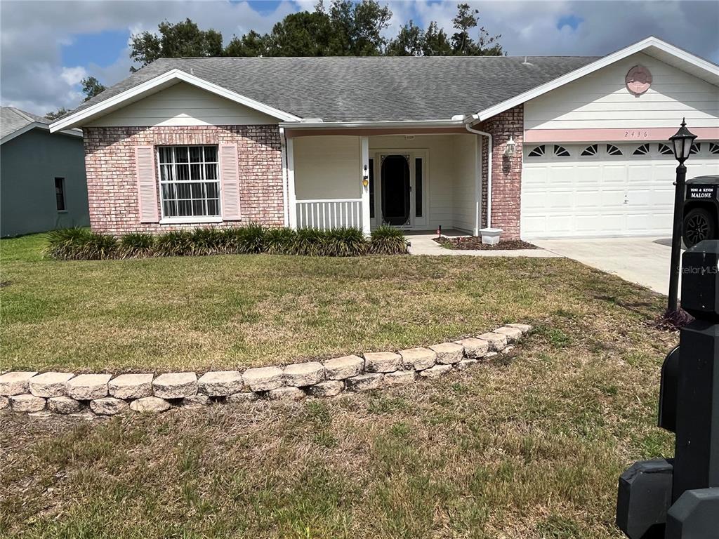 a front view of house with yard