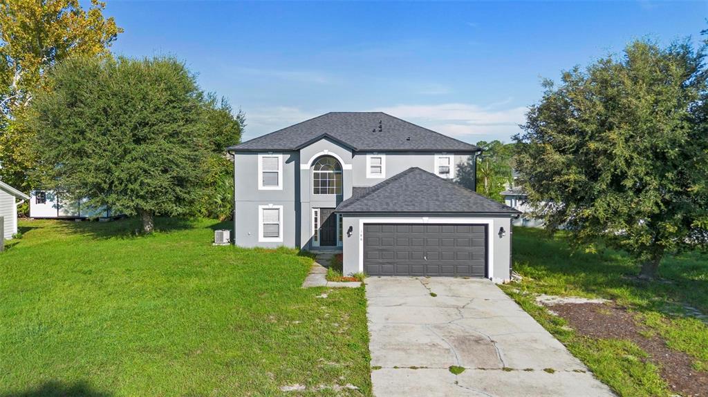 front view of a house with a yard