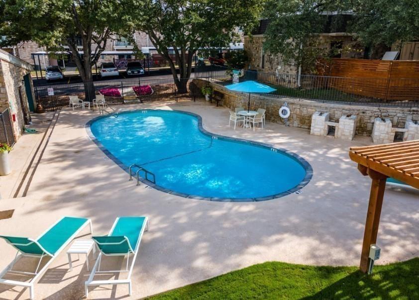 a view of a swimming pool with a patio