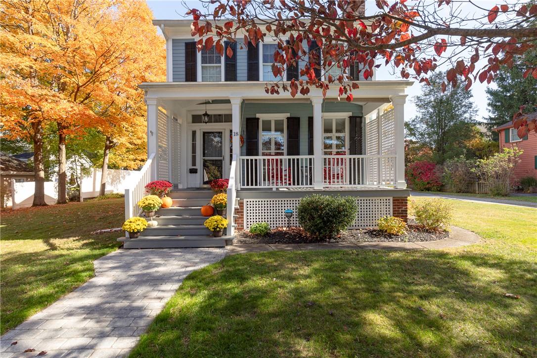 a view of a house with backyard porch and sitting area