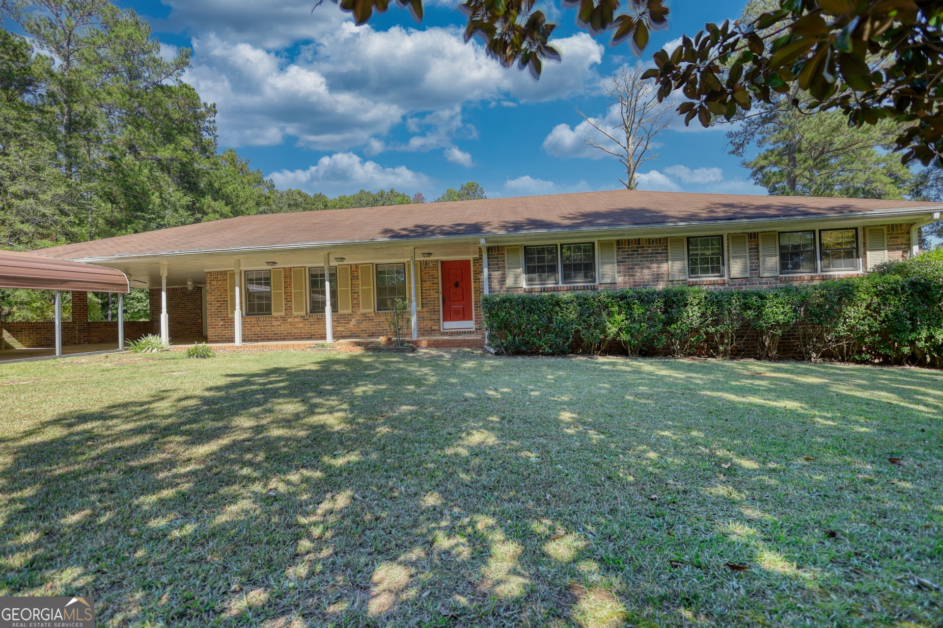 a front view of a house with a garden