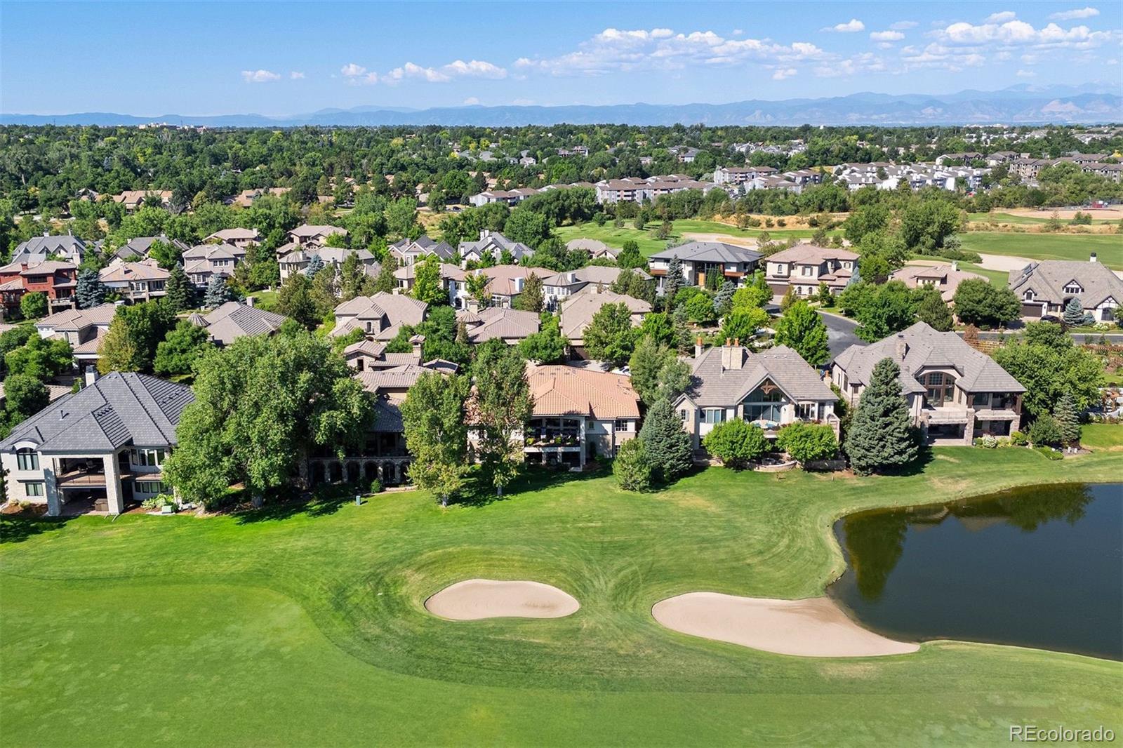 an aerial view of a house with yard swimming pool and outdoor seating