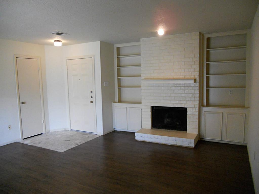 a view of a livingroom with a fireplace