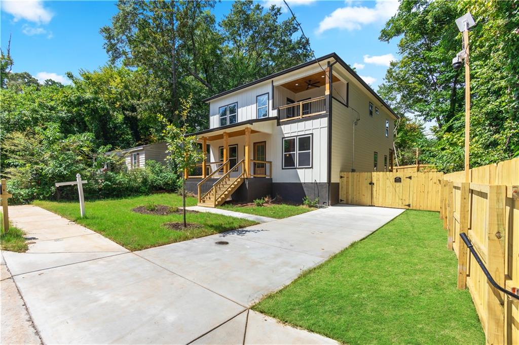 a front view of house with yard and green space