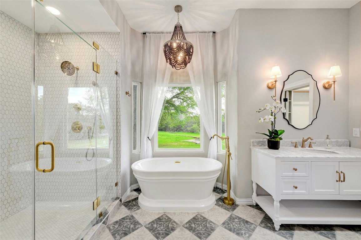 a bathroom with a sink toilet a mirror and shower