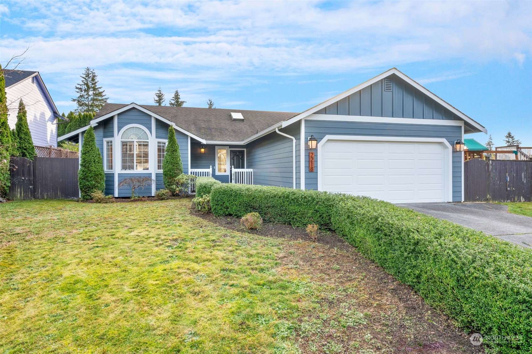 a front view of a house with garden