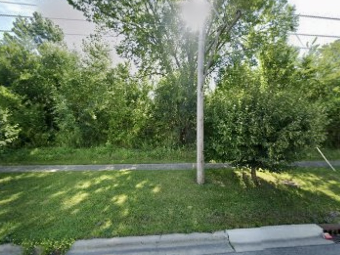 a view of outdoor space with deck and yard