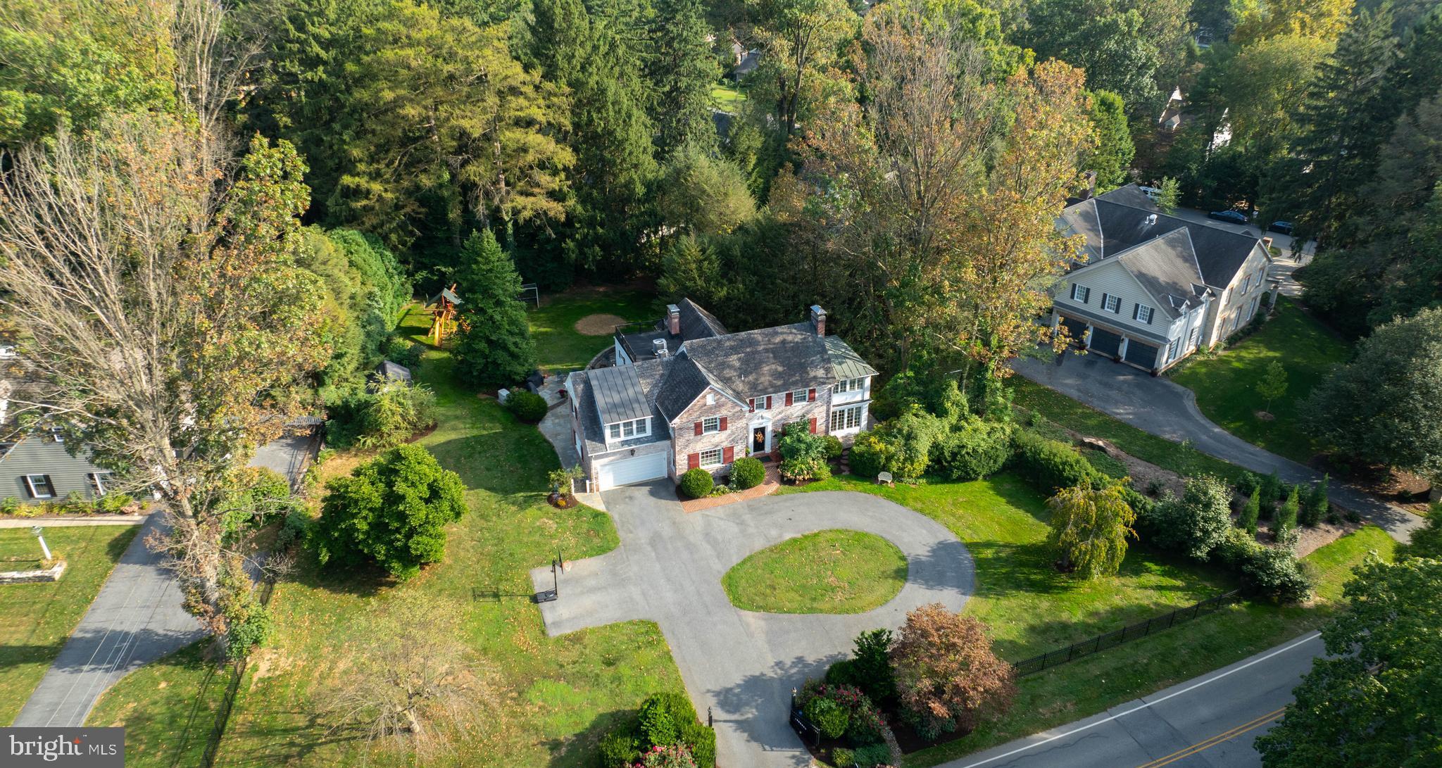 an aerial view of a house with yard swimming pool and outdoor seating