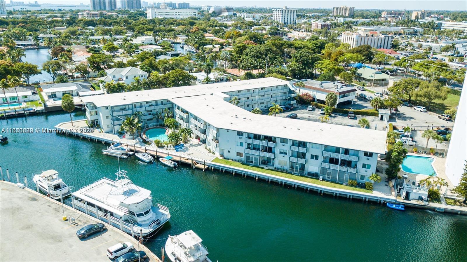 an aerial view of a house with a lake view