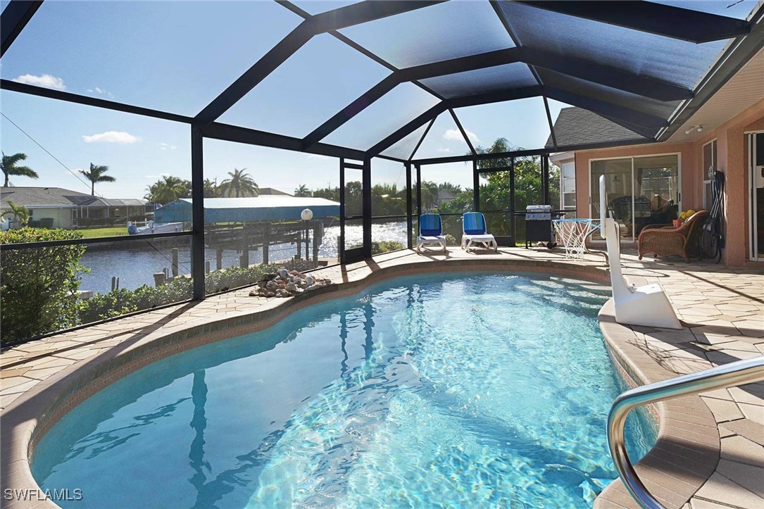 a view of a swimming pool with a patio