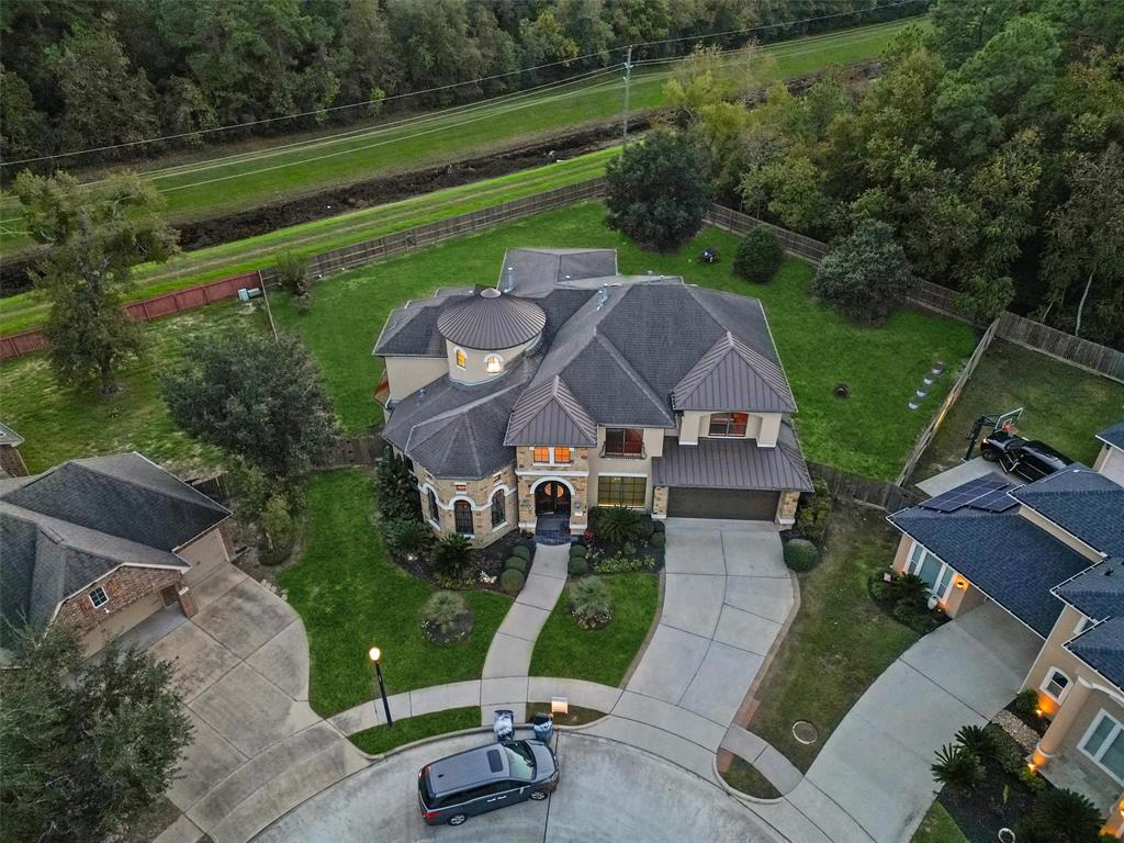 an aerial view of a house with a garden