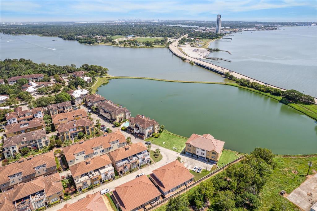 an aerial view of a house with a lake view