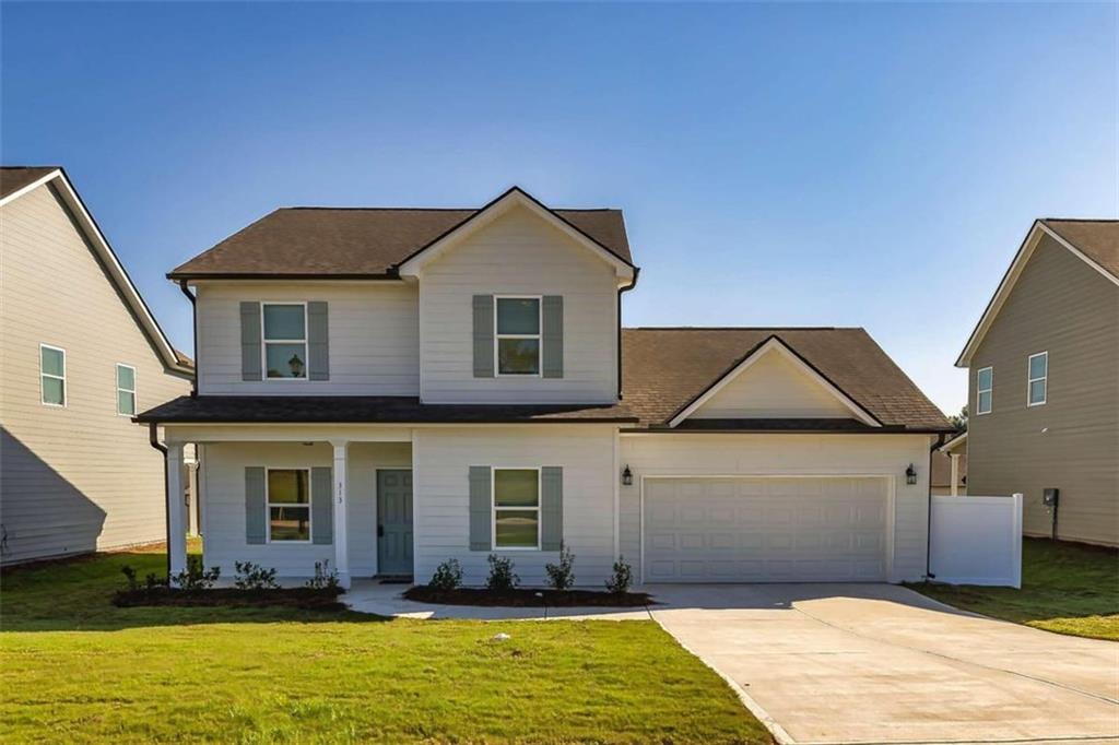 a front view of a house with a yard