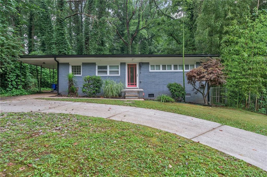 front view of a house with a yard