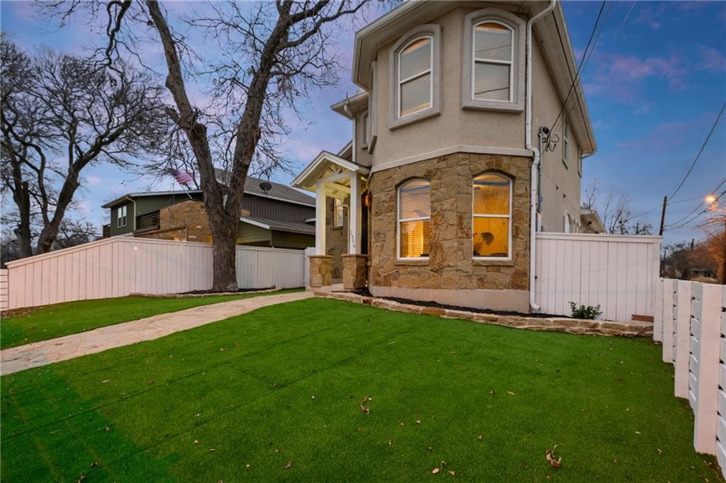 a front view of a house with a yard