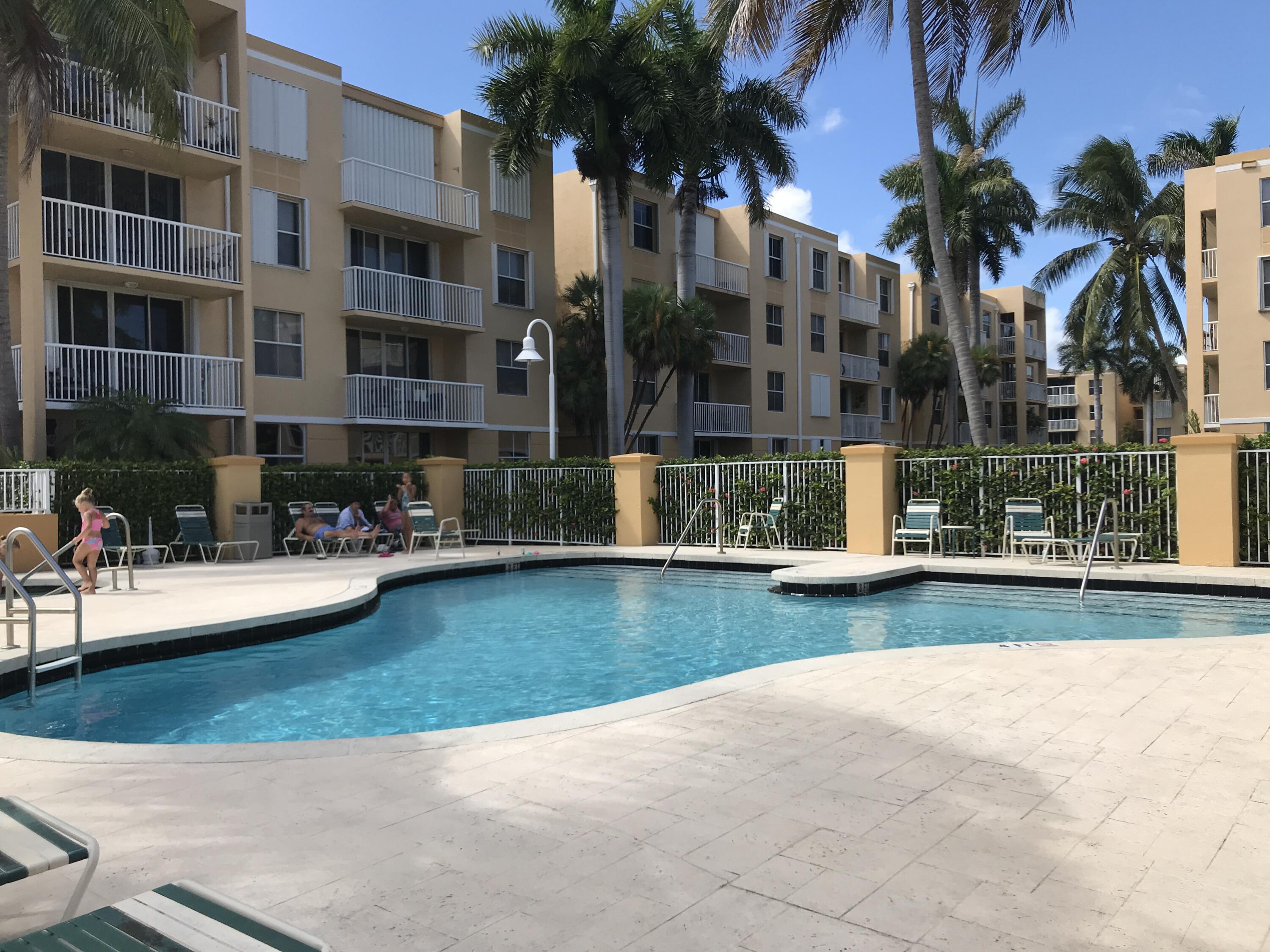 a view of swimming pool is middle and a garden