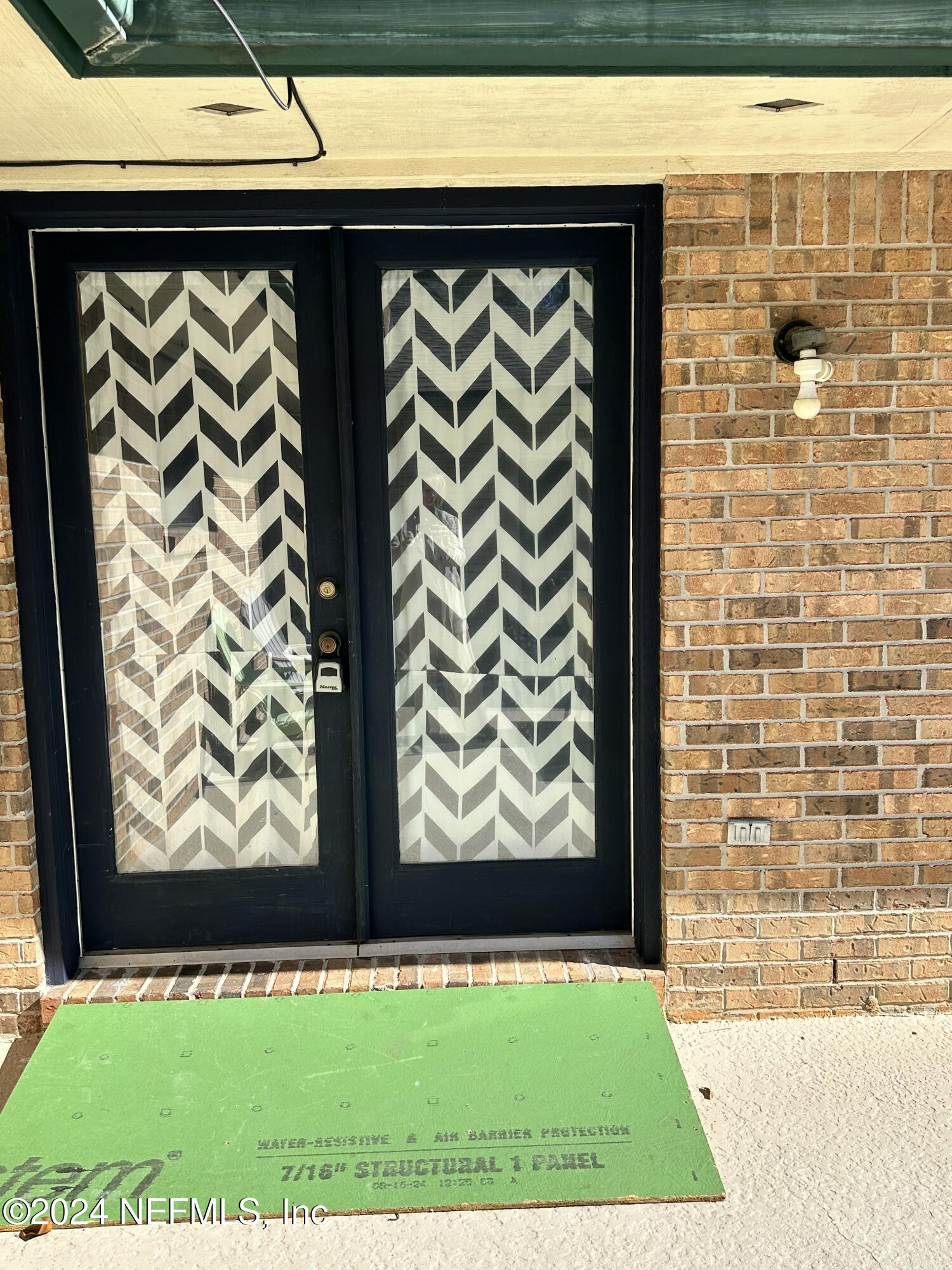 a view of outdoor area with front door