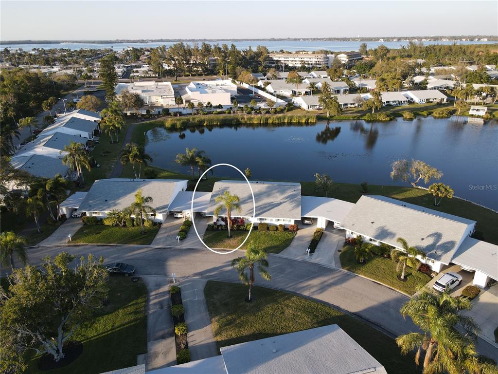 an aerial view of a house with outdoor seating