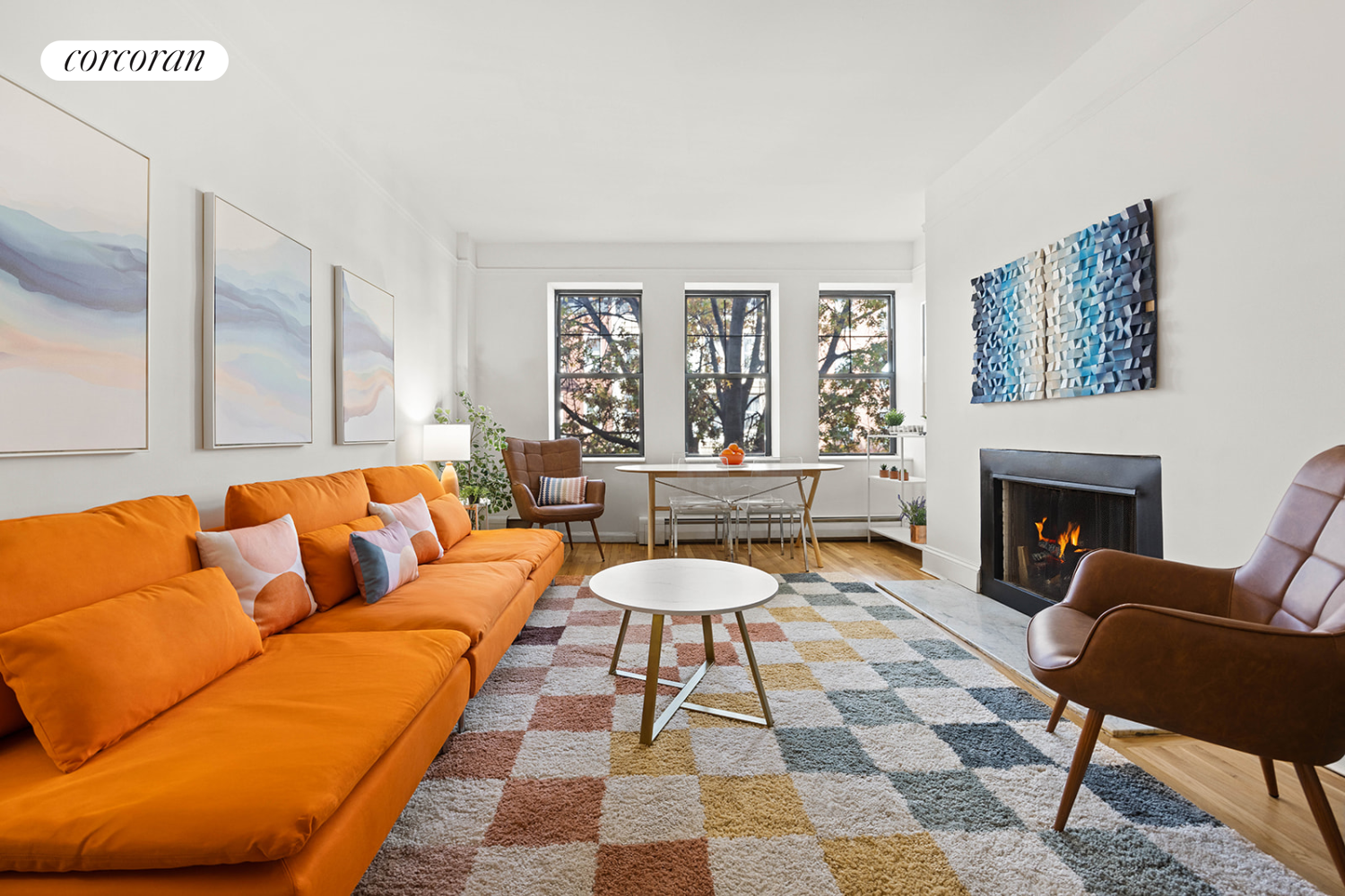 a living room with furniture and a fireplace