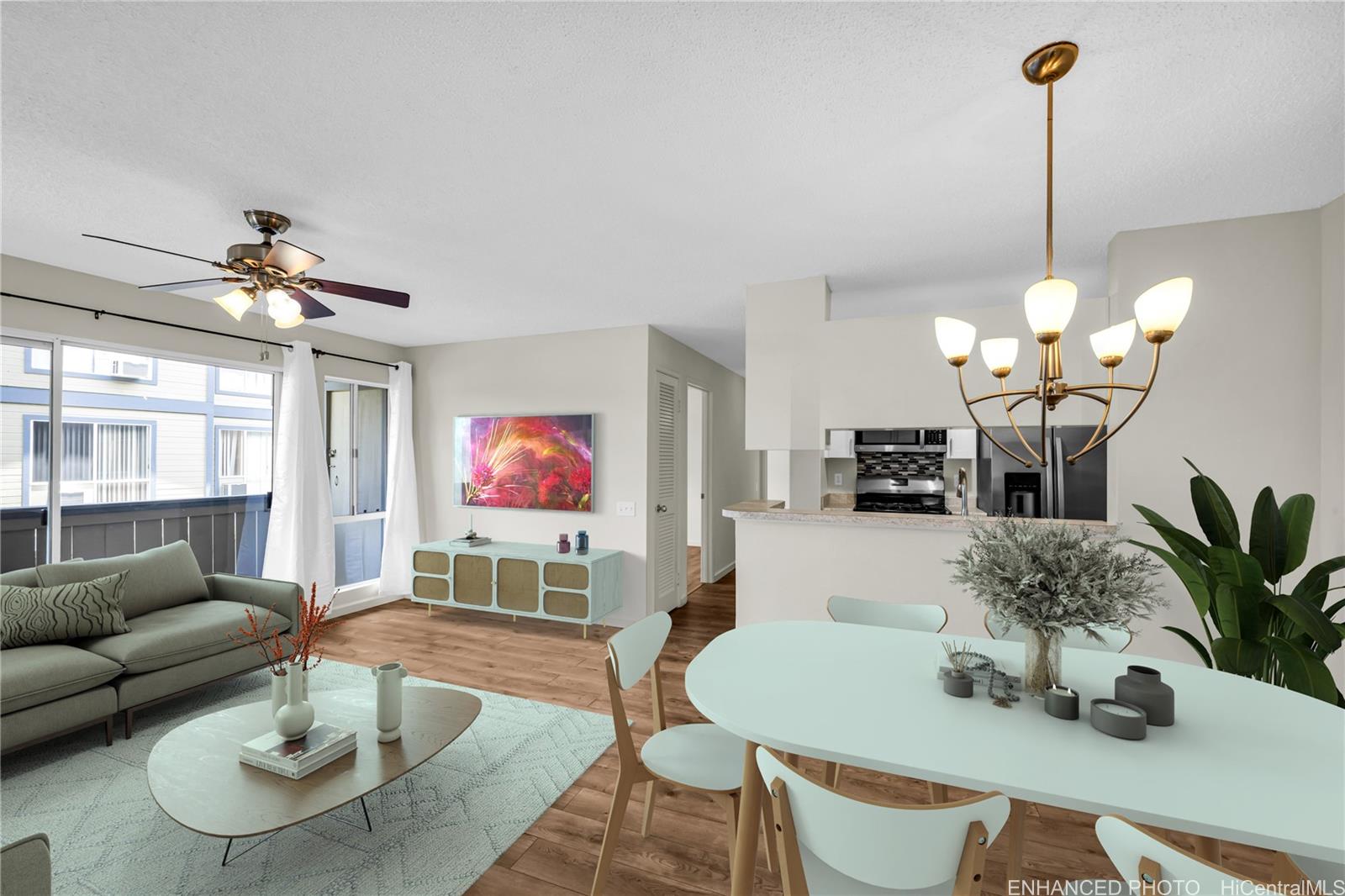 a living room with furniture potted plant and a chandelier