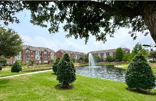 a view of a lake with a building in the background