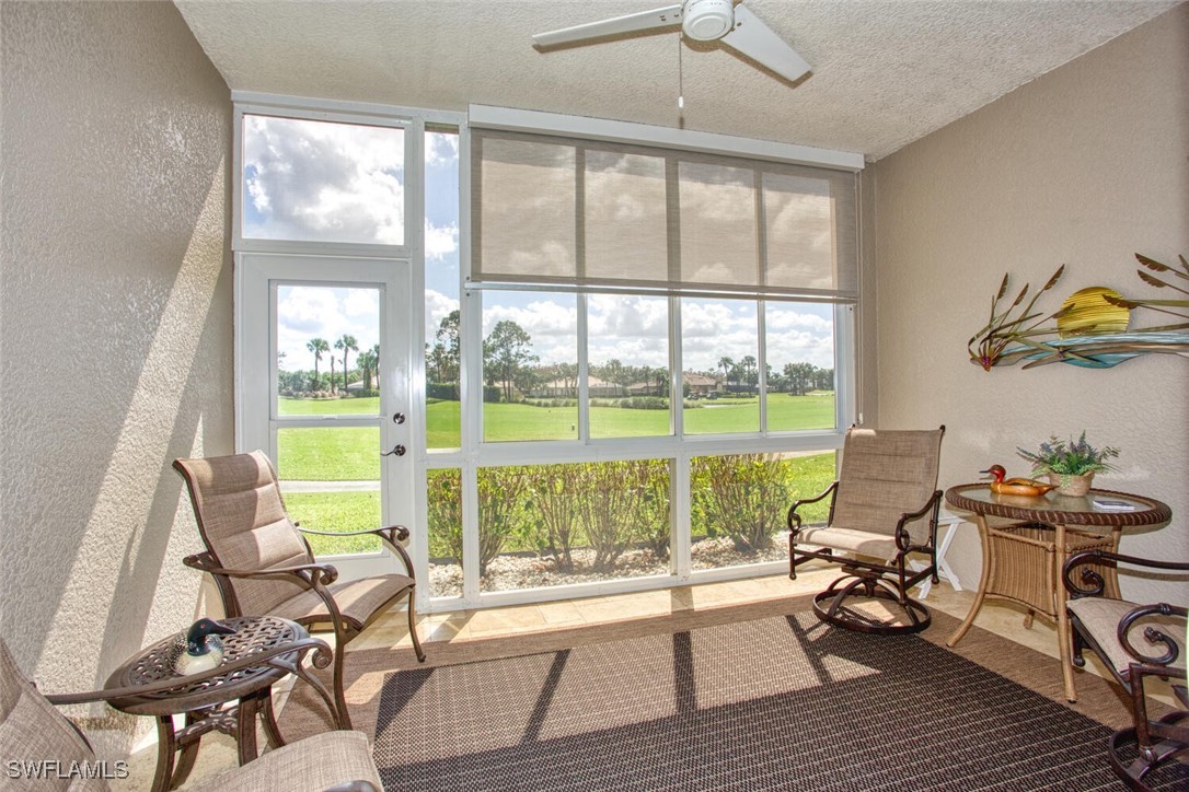 a living room with a large window and table