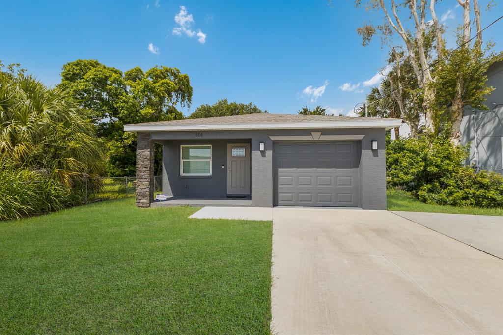 front view of a house with a yard